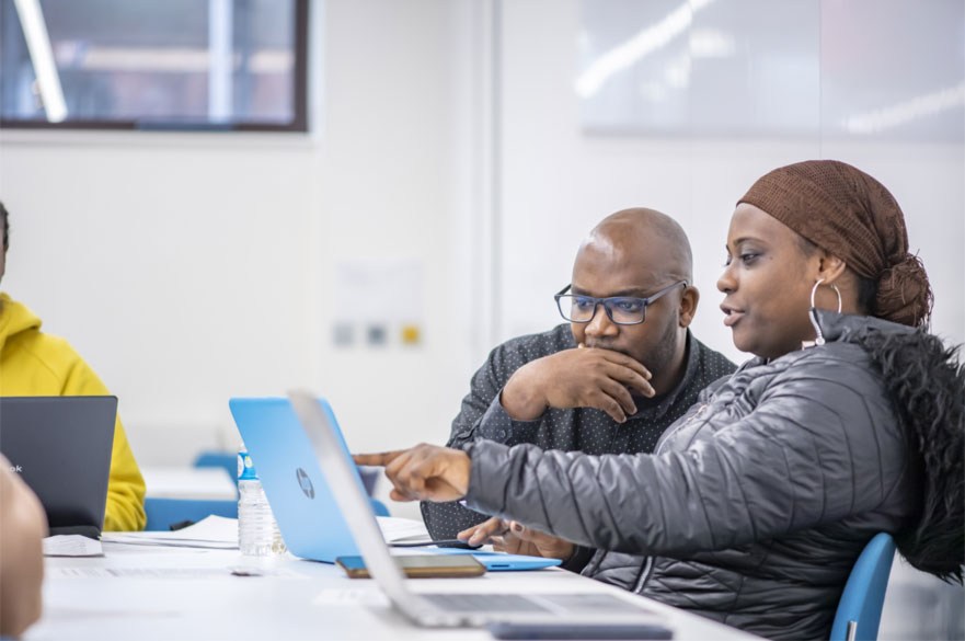 ICT professionals collaborating in a corporate meeting
